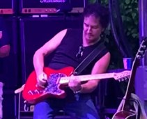 B. James Lowry with guitar