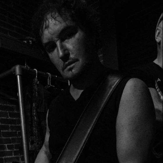 B. James Lowry with guitar